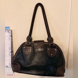 Large vintage dark brown leather Rosetti bag with silver hardware.